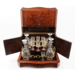 Good quality mid-19th century French liqueur decanter stand with four vine engraved decanters with