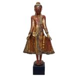 Large late 19th / early 20th century Burmese gilt lacquered Buddha figure in standing pose,