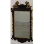 George II walnut and parcel gilt fret carved wall mirror,