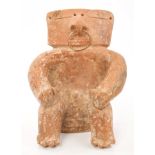 Ancient pre-Columbian Quimbaya pottery slab figure of a seated male with yellow metal ring through