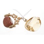 Two gold mounted revolving fobs - to include a gold mounted fob with faceted citrine-coloured stone