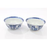 Pair 19th century Chinese blue and white bowls with segmented figure and floral decoration - four