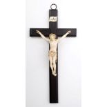 Fine 19th century Continental carved ivory crucifixion on ebonised cross,