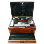 Victorian figured walnut dressing table box, the hinged lid centred by initialled brass shield,