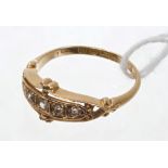 Edwardian gold (18ct) diamond ring with five old cut and rose cut diamonds in openwork scroll
