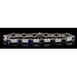 Diamond and sapphire bracelet with an articulated line of brilliant cut diamonds alternating with