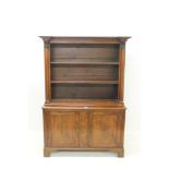 Regency mahogany two height open bookcase with beaded and moulded architectural frieze,