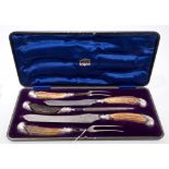 George V five piece carving set with stag horn handles and silver mounts, in original case,