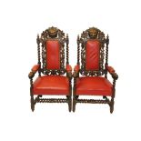 Large pair of Victorian carved oak upholstered elbow chairs,
