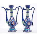 Pair 19th century Chinese Canton enamel ewers of Middle Eastern metalwork form, with tall,