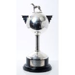 1930s silver Art Deco-style coursing trophy in the form of a ball, with stepped handles,