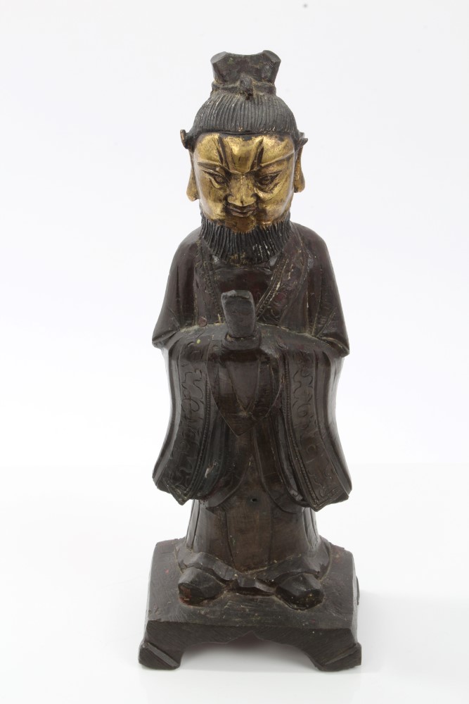 Chinese Qing period bronze and parcel gilt figure of a bearded man in robes, holding a tablet, 23.