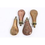 Group of four 19th century copper and brass powder flasks - to include a plain Sykes Patent flask,