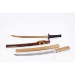 17th century Japanese wakizashi with Koshirae - the unsigned curved blade with waved hamon with