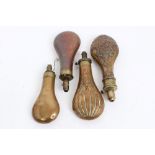 Group of four 19th century copper and brass powder flasks - to include an embossed flask by James