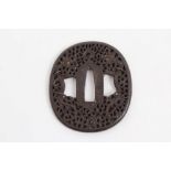 Fine 17th / 18th century Japanese iron tsuba with finely reticulated dragon and pearl decoration,