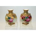 R Austin for Royal Worcester- vase of spherical form hand decorated with roses on a blush ground,