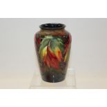 Moorcroft pottery vase, decorated in the leaf and berry pattern,