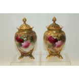 Pair of Royal Worcester pot pourri vases and covers hand decorated with pink roses on a blush