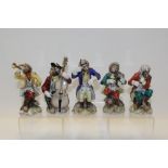 Meissen-style five piece monkey band with blue crossed swords marks to base CONDITION