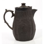 Late 18th century Castleford black basalt hot water jug and cover with applied classical figure