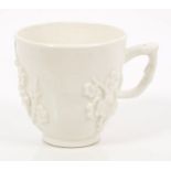 18th century Bow blanc-de-chine coffee cup with applied prunus decoration, 6.