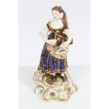 19th century Derby figure depicting the Idyllic Musician - a female musician playing the triangle,