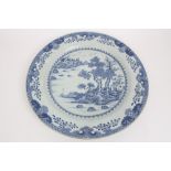 Large 18th century Chinese export blue and white charger with painted Chinese landscape within