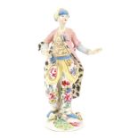 18th century Bow porcelain figure of a Turk, with polychrome floral decoration,