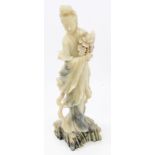 Chinese soapstone carving of Guanyin, the finely carved mottled stone figure with flowing robes,