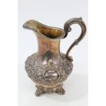 Victorian silver cream jug of baluster form, with band of chased scroll and floral decoration,