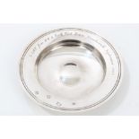 Contemporary silver dish of circular form, with dished centre and flared rim,