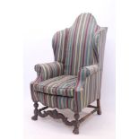 William & Mary-style wing armchair with high camel back, fully upholstered in striped fabric,