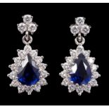 Pair sapphire and diamond cluster pendant earrings,