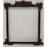 A 19th century Black Forest carved wood frame with ivy leaf decoration - internal size 60cm x 50cm