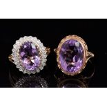 Amethyst and diamond cluster ring with an oval mixed cut amethyst,