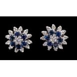 Pair sapphire and diamond flower-head cluster earrings in tiered white gold (18ct) claw setting,