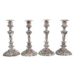 Fine quality set of four William IV silver candlesticks with tapering columns and allover rococo