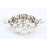 Edwardian silver quaich of lobed form with pierced handles, underside stamped - R. & S.