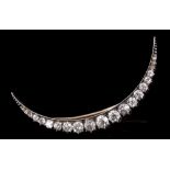 Victorian diamond crescent brooch with twenty-one graduated old cut and rose cut diamonds in silver