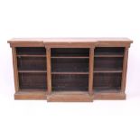 19th century breakfront open bookcase with adjustable shelves between projecting fluted columns,