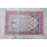 Good part silk Kashan rug - cream field with urn issuing scrolling flowering foliage within meander
