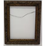 A 19th century carved wood gilt frame - internal size 41cm x 31cm