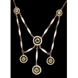 Edwardian peridot and white enamel necklace with six round mixed cut peridots within an openwork