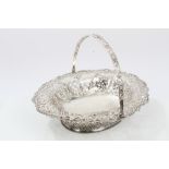 George V silver bread basket of flared oval form, with pierced decoration and ropework border,