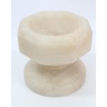 Late 19th century carved alabaster travelling font of octagonal form, 8cm diameter,