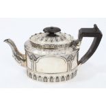 Victorian silver teapot of oval form, with chased foliate and applied arch-shaped decoration,