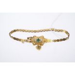 19th century yellow metal bracelet with a panel set with emeralds and seed pearls with a