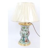 A Chinese vase mounted as a table lamp, with famille rose bird and floral decoration and with shade,
