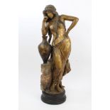 Large early 20th century Goldscheider pottery figure of Rebecca the water carrier resting on an